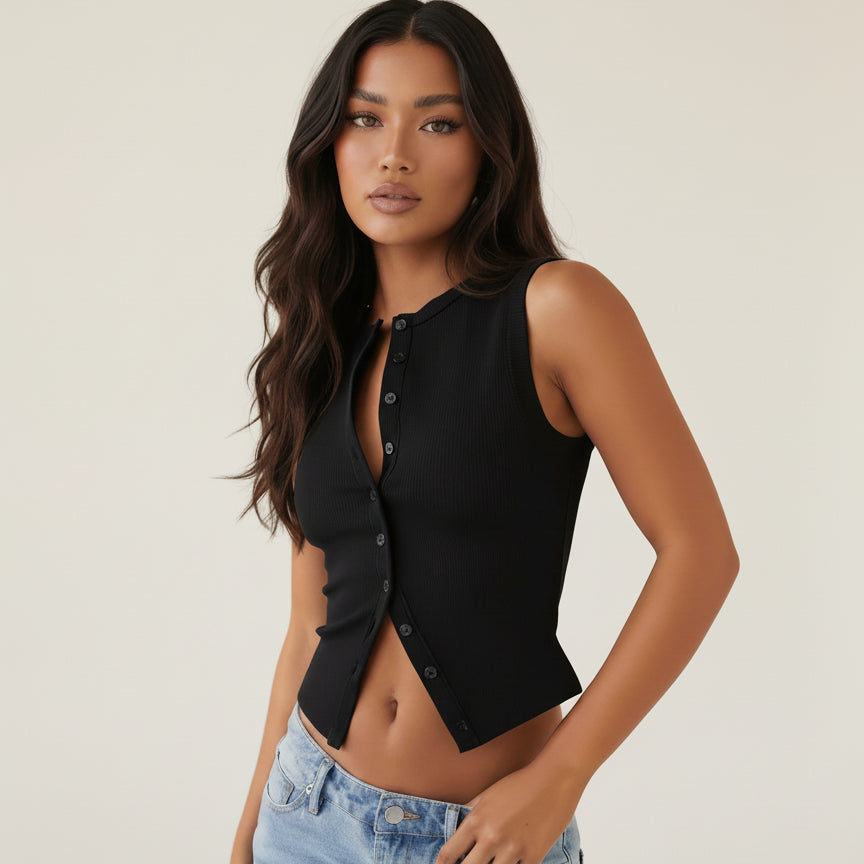 Woman wearing a black sleeveless top and blue jeans on a white background